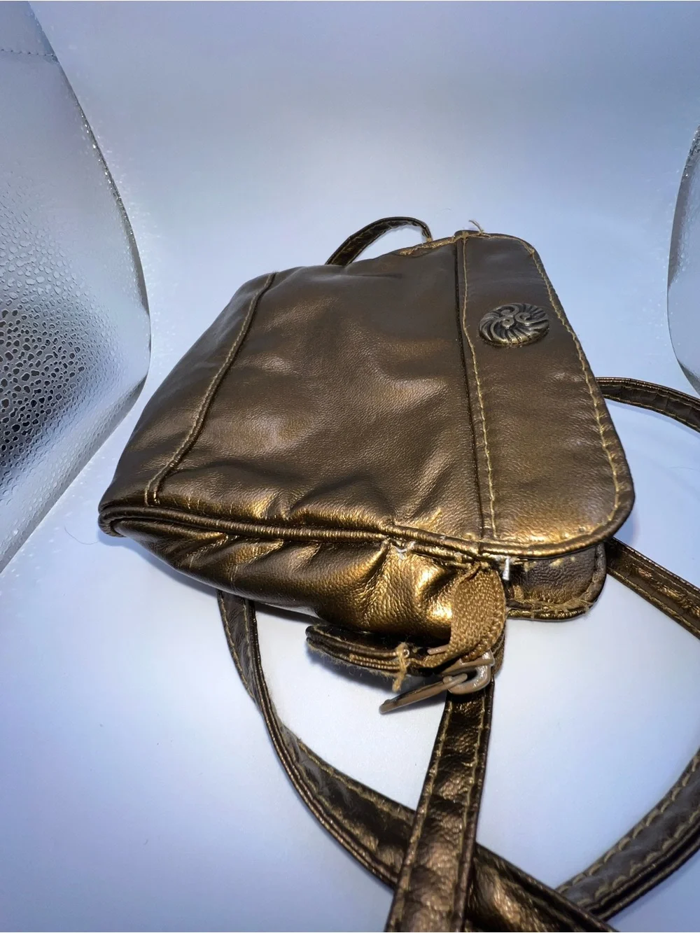 Vintage metallic bronze crossbody purse manufactured by the brand Beverly Hills
